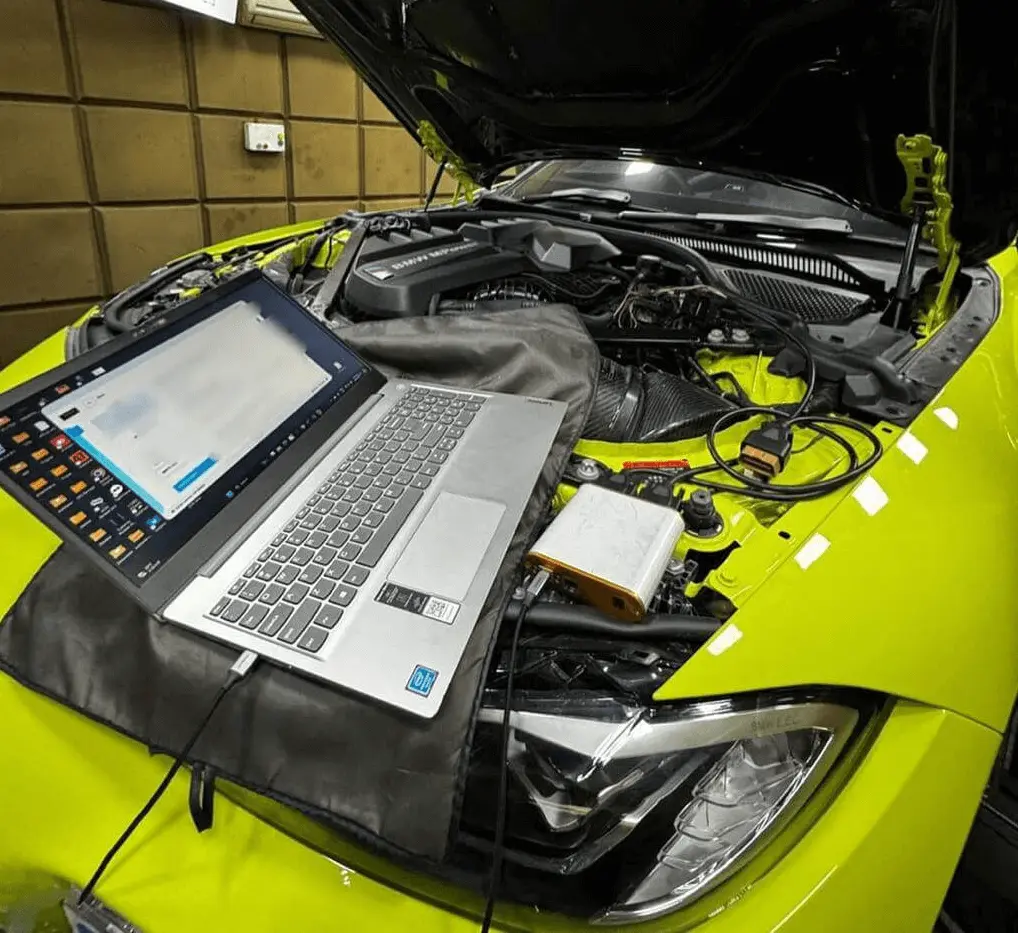 Image of car undergoing Engine Diagnostic Test service at workshop